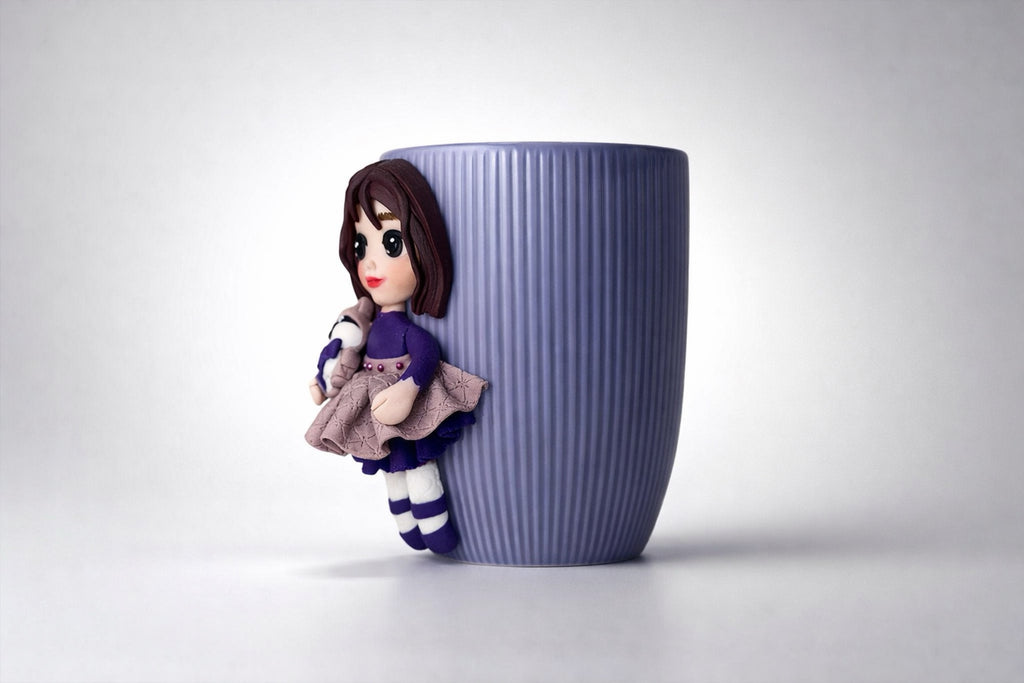 Ceramic mug with hand-modeled 3D doll figure and raccoon made of polymer clay 