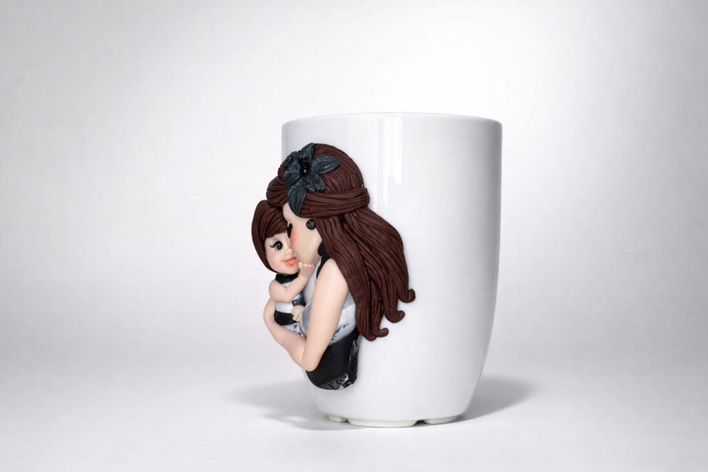 Feldspar porcelain cup with hand-modeled 3D mother-and-daughter figures made of polymer clay 