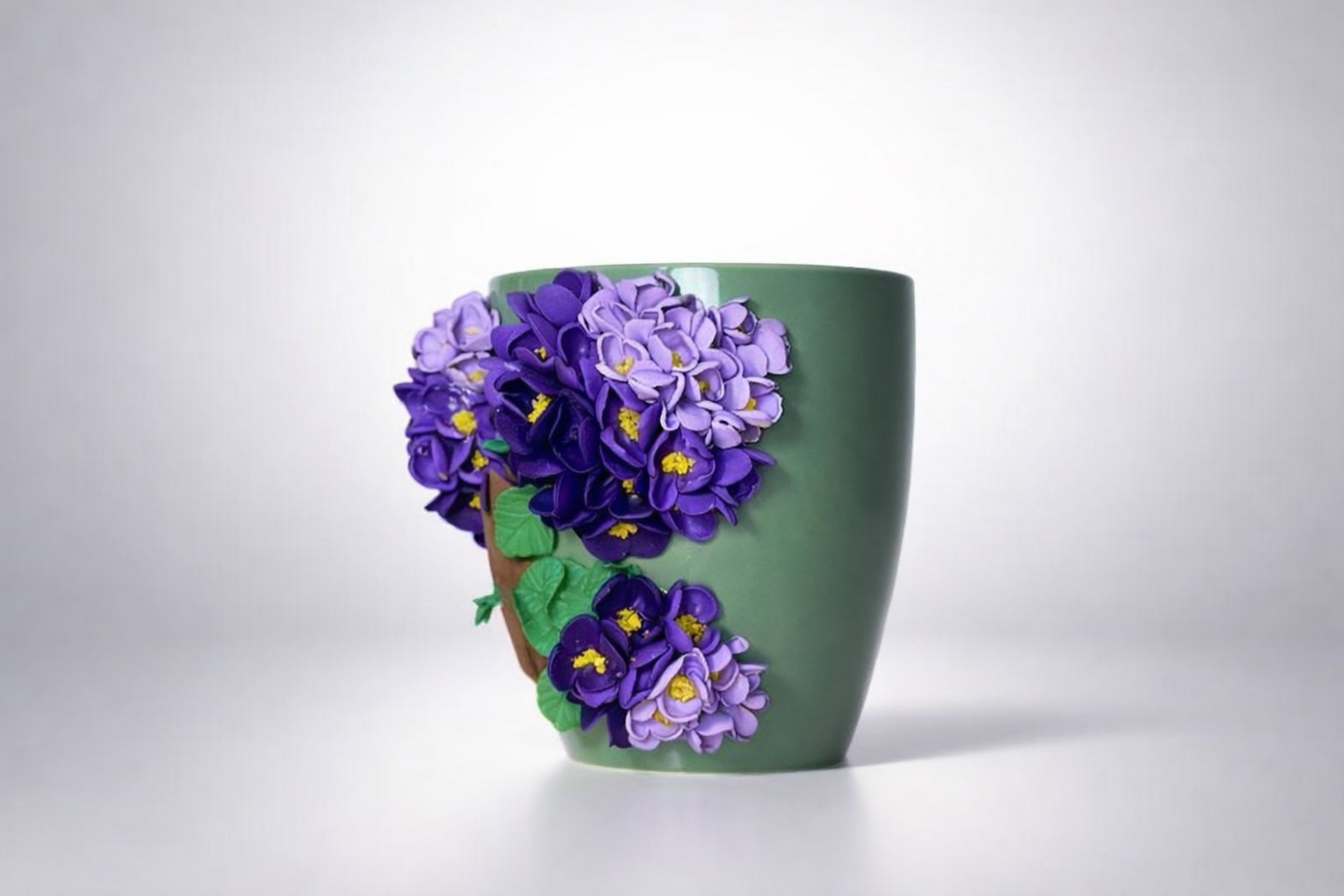 Ceramic mug with hand-modeled 3D lilac blossoms made of polymer clay 