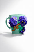 Ceramic mug with hand-modeled 3D lilac blossoms made of polymer clay 