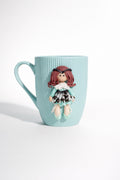 Ceramic mug with hand-modeled 3D doll figure made of polymer clay